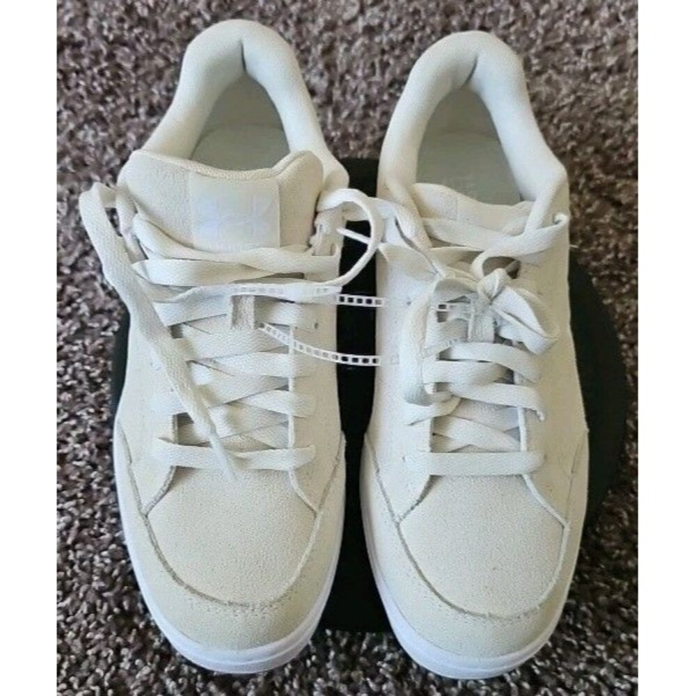 Under Armour size 8.5 off Women’s white Suede tennis shoes with gummy soles.